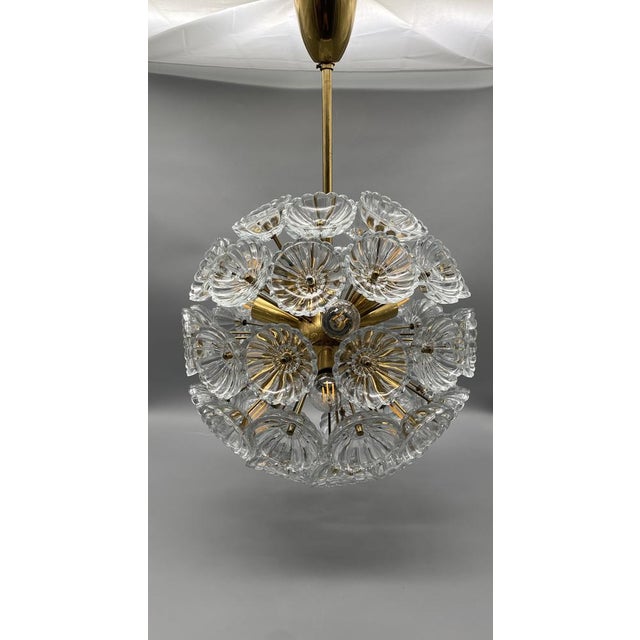 A ceiling lamp *the design is very similar to the designs of the austrian designer emil stejnar, but it was a factory...