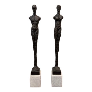 Late 20th Century Pair of Giacometti Style Male & Female Figural Sculptures on Marble Bases For Sale