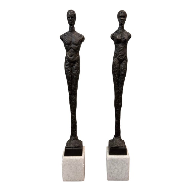 Late 20th Century Pair of Giacometti Style Male & Female Figural Sculptures on Marble Bases For Sale