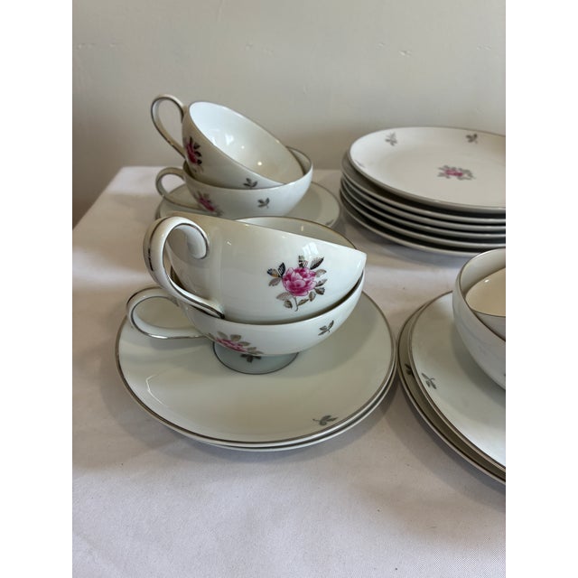 Elegant vintage Fukagawa Arita porcelain tea set from Japan featuring a delicate pink rose motif with silver trim. This...
