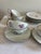 Elegant vintage Fukagawa Arita porcelain tea set from Japan featuring a delicate pink rose motif with silver trim. This...