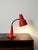 Scandinavian table lamp by Gemi in red lacquered metal, with a flexible, adjustable neck and perforated shade. Table lamp...