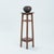 This beautiful wooden plant stand or wooden pedestal. It features a tall, slender frame with four legs that taper...