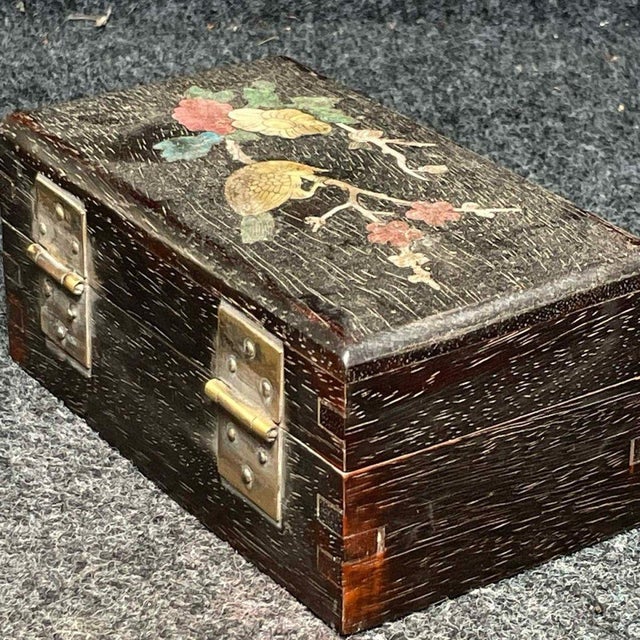 This exquisite vintage jewelry box is a beautiful example of traditional Asian craftsmanship. Crafted from a richly...