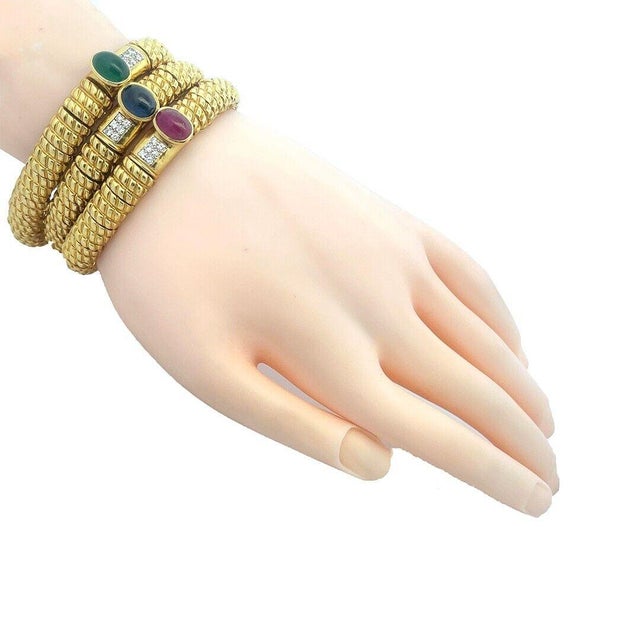 This is a gorgeous set of 3 bracelets by Cassis Jeweler, they are crafted from 18k yellow gold featuring triple ribbed...