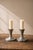 This original pair of candlesticks is the work of the famous Danish designer Just Andersen 1884 to 1943 model 2729. An...