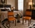 Pair of Art Deco side chairs, solid walnut with original leather upholstery of the time. Restored and polished to wax....