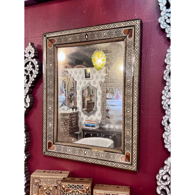This elegant vintage mirror showcases the timeless beauty of Middle Eastern marquetry craftsmanship. The handcrafted frame...