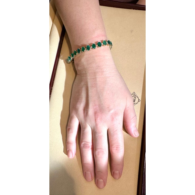 This exceptionally affordable Tennis bracelet has 24 stones of oval Emeralds . Each Emerald is spaced by two diamonds...