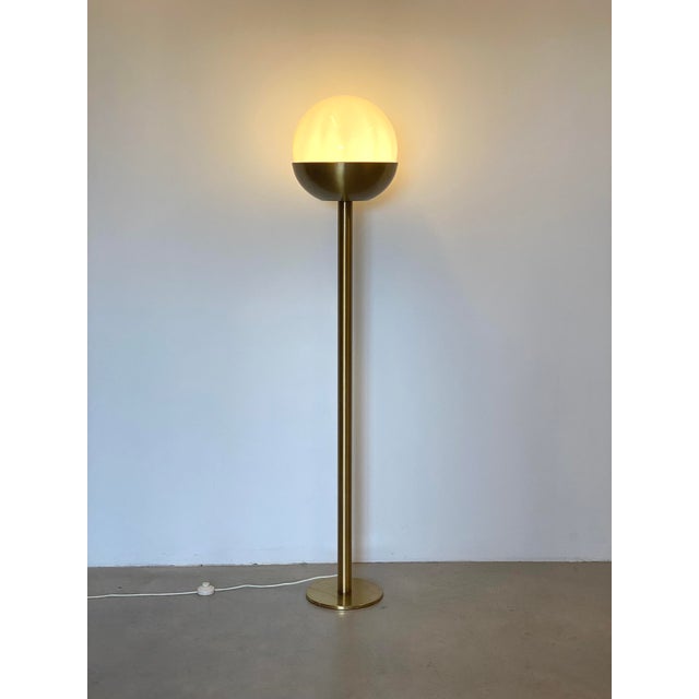 Floor lamp in the style of Pia Guidetti Crippa from the 70s, brass structure and glossy white opaline glass diffuser....