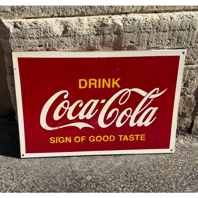 Vintage Coca-Cola metal advertising sign, featuring the classic red graphics and white "Drink Coca-Cola – Sign of Good...