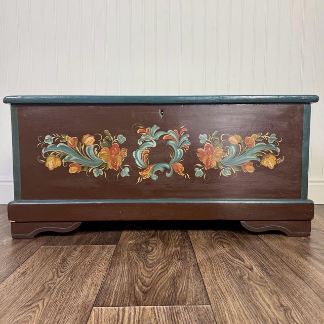 A masterpiece of Scandinavian heritage, this authentic, hand-painted cedar chest isn’t just a storage piece; it is a work...