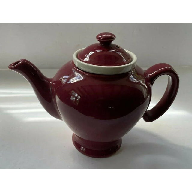 Vintage Hall McCormick Tea Pot. The Dark Red Maroon Tea Pot has a Ceramic Infuser and Lid. It makes 4 cups. Made by Hall,...