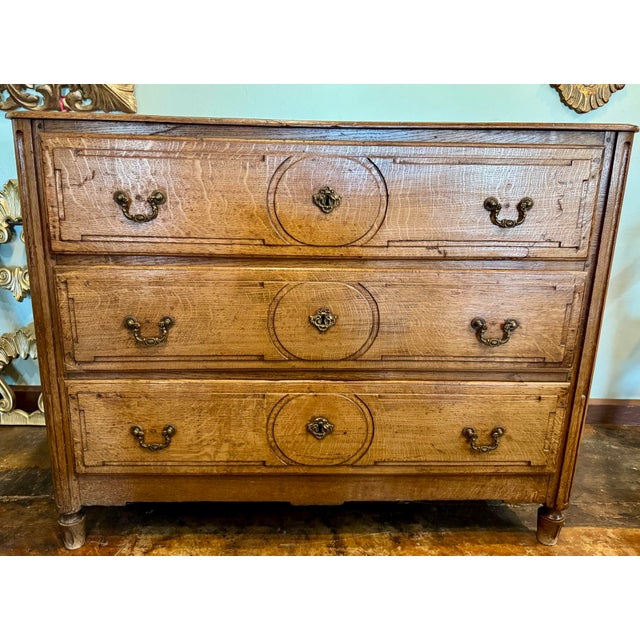 Stately 19th Century Oak Chest of Drawers From France With Graceful Brass Door Pulls. Has 3 deep drawers and original key....