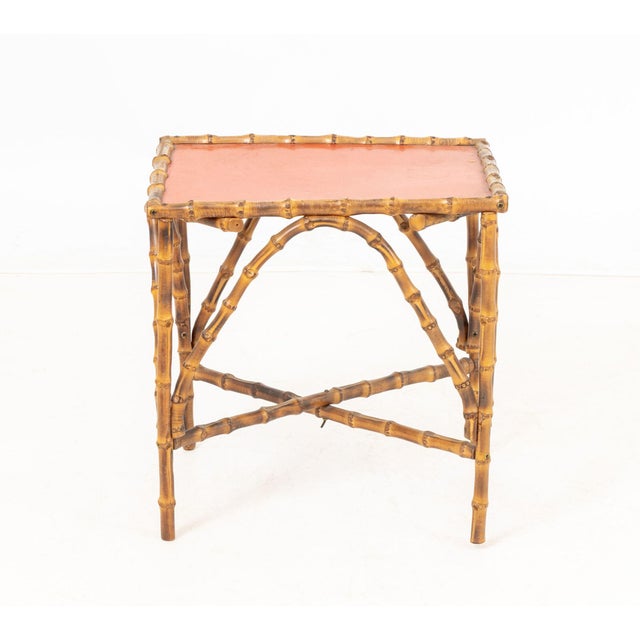 Bent Bamboo Red Painted Top Side Table, on four supports conjoined by box stretcher. 15.25" H x 15" W x 12.25" D....