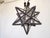 This copper star light, opens to change the bulb and uses one candelabra bulb up to 60Watts.
