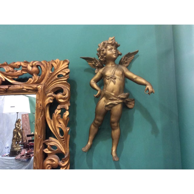 Antique Gilt patinated metal cherub with wings. This can easily be made into a hanging light.