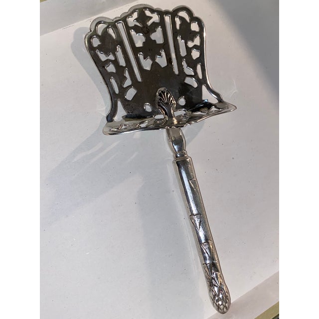 Ornate antique silver-plated asparagus server with pierced decorative blade. No makers mark Asparagus servers, also known...