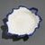 English shell edge pearlware grape leaf condiment dish on three hemispheric feet. Stamped on the underside: T England,...