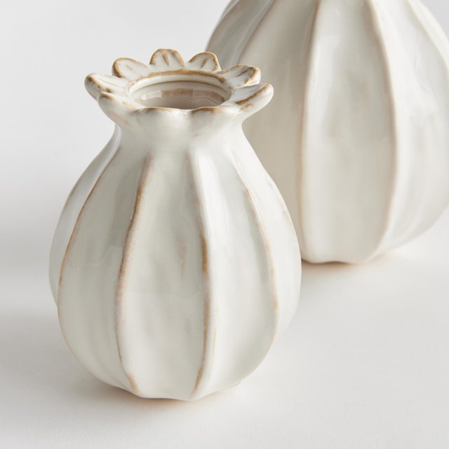 With a sculpted body and thicklyapplied reactive glaze, this pair of bud vases is a work of art. The handfinished details...