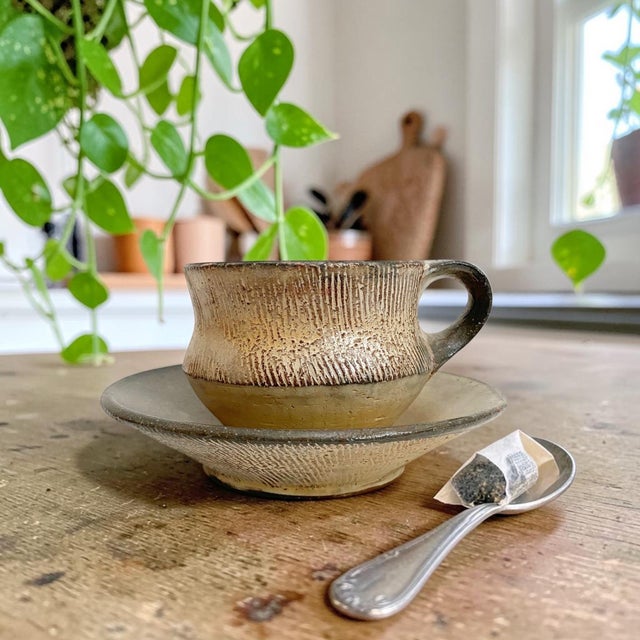 Experience the perfect blend of artistry and functionality with this Handmade Ceramic Coffee Cup and Saucer Set. Crafted...