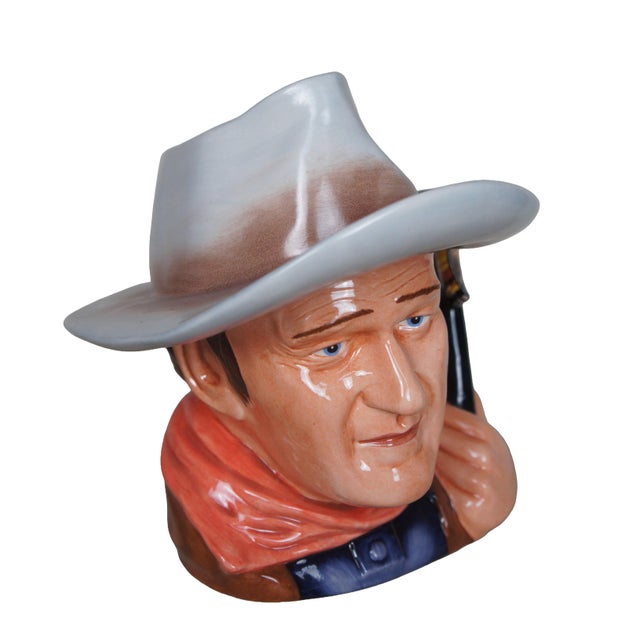 Vintage Royal Doulton 7269 porcelain character jug pitcher of John Wayne. Designed by Tim Potts, circa 2007. It depicts...