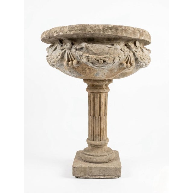 This exceptional garden urn is a masterclass in Neoclassical symmetry and architectural proportion. Crafted from...