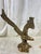 Bring timeless craftsmanship and dramatic movement to your home with this vintage solid cast brass eagle sculpture....