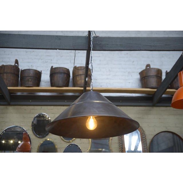 Large Bekaert saucer-shaped metal pendant lamps 1960. Up to 250V (Europe/UK Standard).The wiring of this item may be...