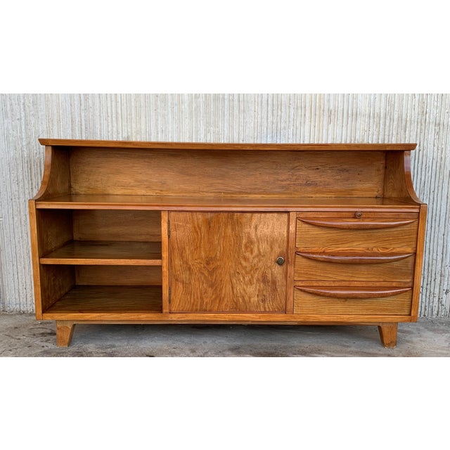 About Mid-Century Modern small chest of drawers in teak manufactured circa 1960s. This piece includes three low...