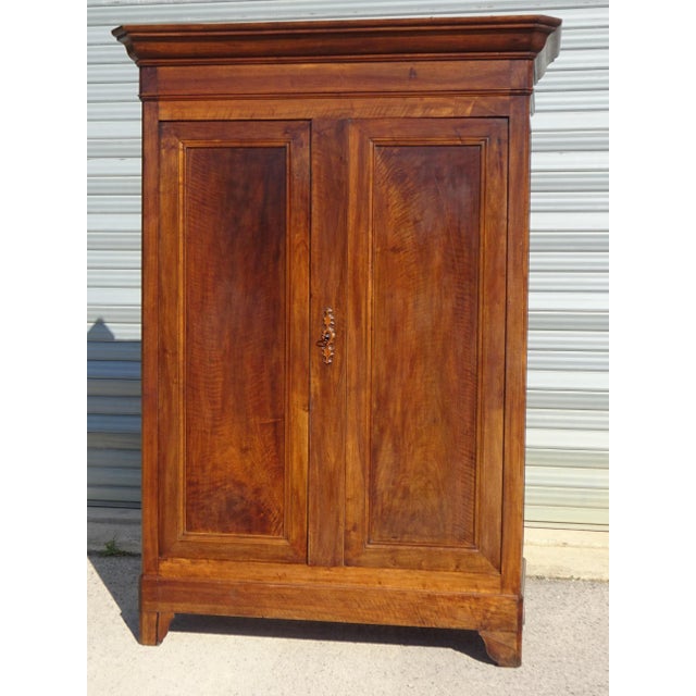 Antique Louis-Philippe style wardrobe (19th century). A majestic piece of furniture with simple, straight lines, destined...