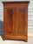 Antique Louis-Philippe style wardrobe (19th century). A majestic piece of furniture with simple, straight lines, destined...