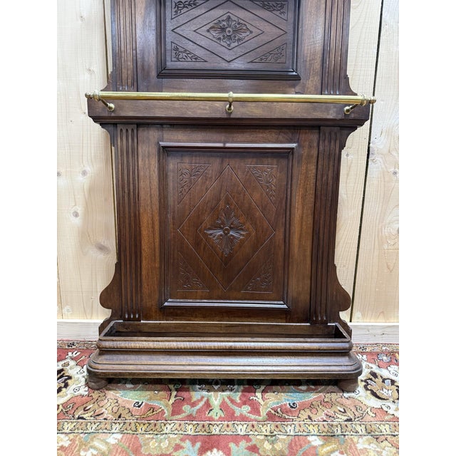 Narrow Napoleon III period coat rack/cloakroom in walnut with brass hooks. Beautiful, compact model that fits easily into...