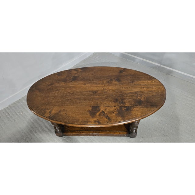 Very good oval burr oak plank coffee table with plank undertier, peg joined throughout, in overall excellent condition....