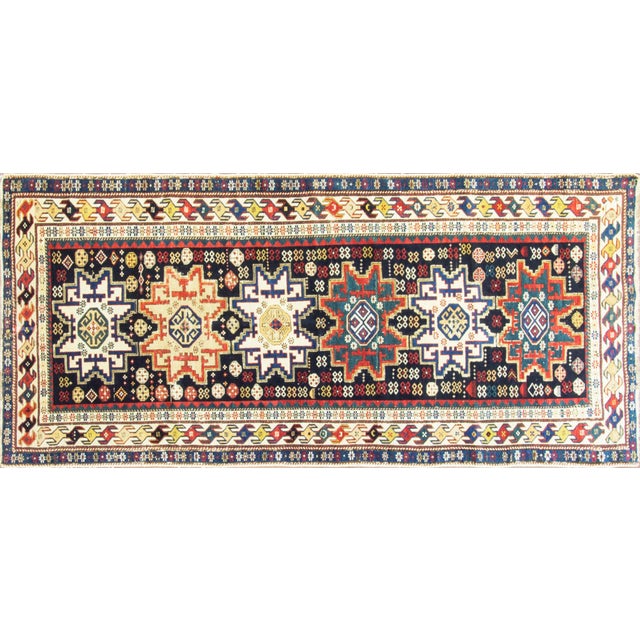 Looking closely at the design and the back, I think Shirvan is a good attribution for this runner. The relatively fine...