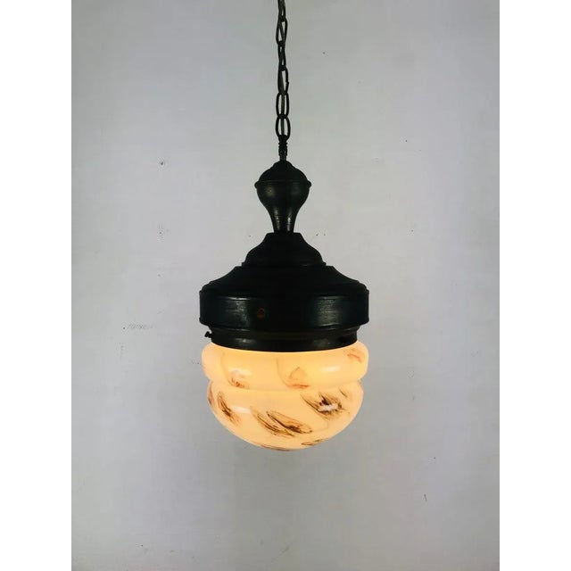 Beautiful art deco ceiling lamp. The marbled glass is in perfect condition. On and off a true eyecatcher. This lamp is...