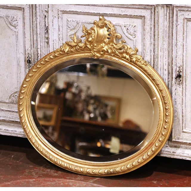 Decorate a powder room, hallway, or bedroom with this elegant antique wall mirror. Crafted in France circa 1890, the oval...
