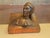 A finely cast bronze sculpture of Dante Alighieri, masterfully integrated into the form of an open book. The bust captures...