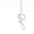 A delicate Tiffany & Co. Elsa Peretti Small “G” Alphabet pendant necklace crafted in sterling silver, featuring Peretti’s...