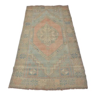 Handwoven Vintage Oushak With Faded Floral Medallion For Sale