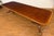 This is a multi-banded mahogany dining table by Leighton Hall. It features a field of cathedral mahogany with exotic...