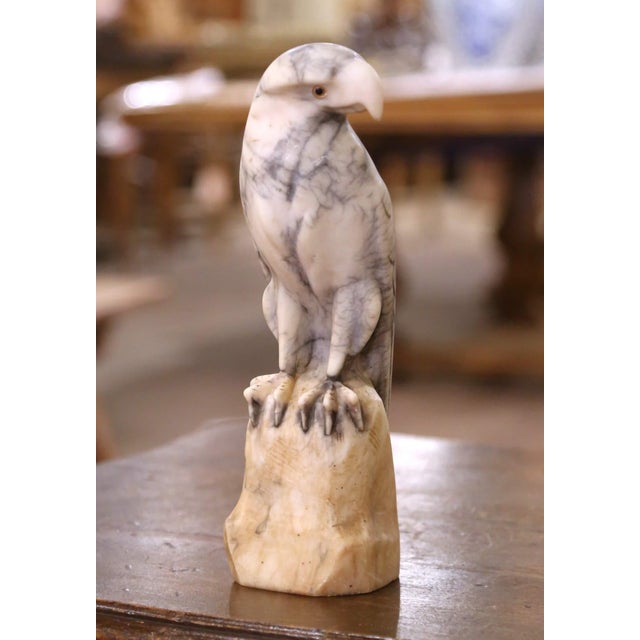 Carved in France circa 1880, this striking eagle sculpture captures the commanding presence of a bird of prey in exquisite...