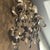 Balanced the opulence of an 18th-century crystal chandelier with a rustic iron frame forged into curving scrollwork. Three...