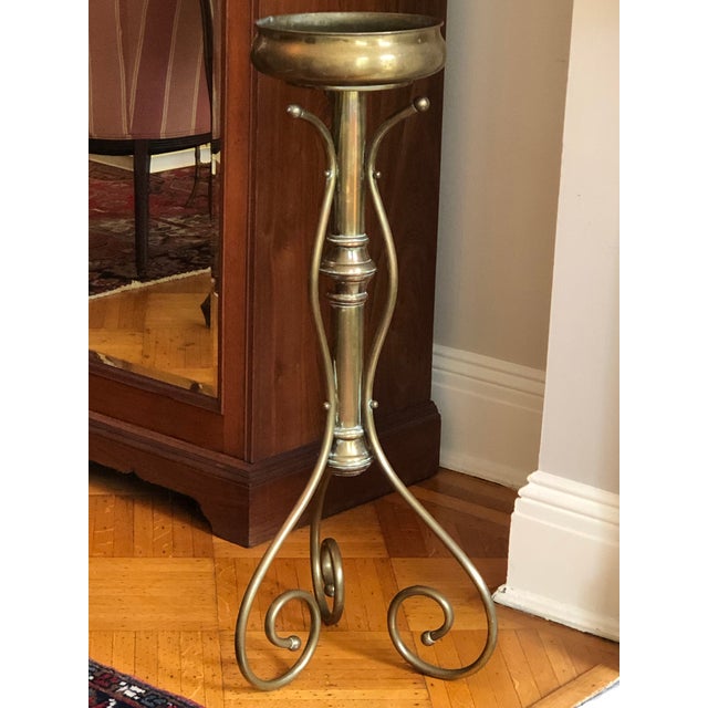 Wow! Love this! Offering a gorgeous mid-20th century brass jardiniere plant stand with lovely warm patina that really...