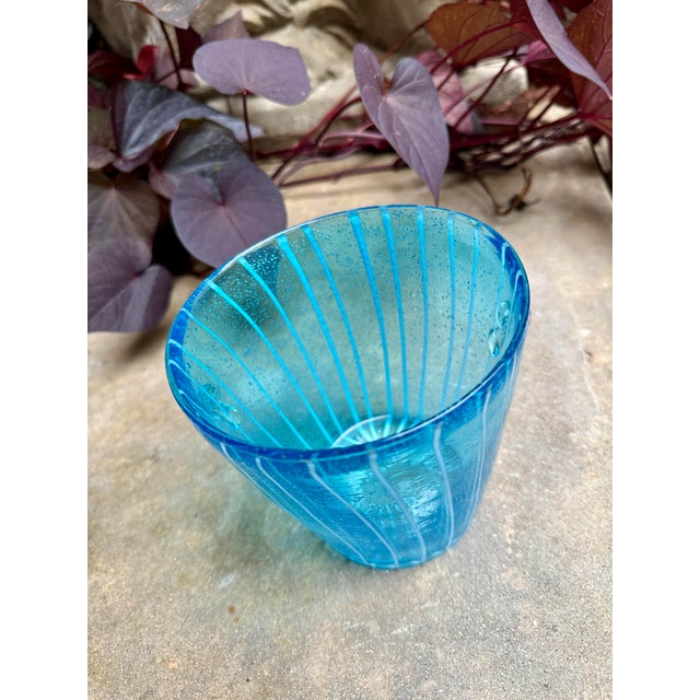 ⸻ Handblown Aqua Art Glass Vase with Controlled Bubbles A stunning handblown art glass vase in vibrant aqua blue, accented...