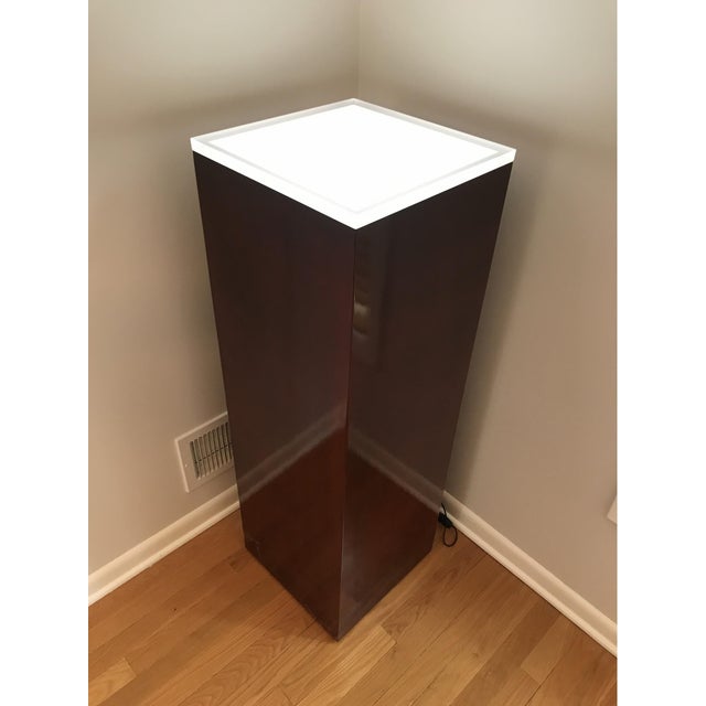 A tall rectilinear vintage lighted display pedestal with a black corded power switch. Product Information: Materials:...