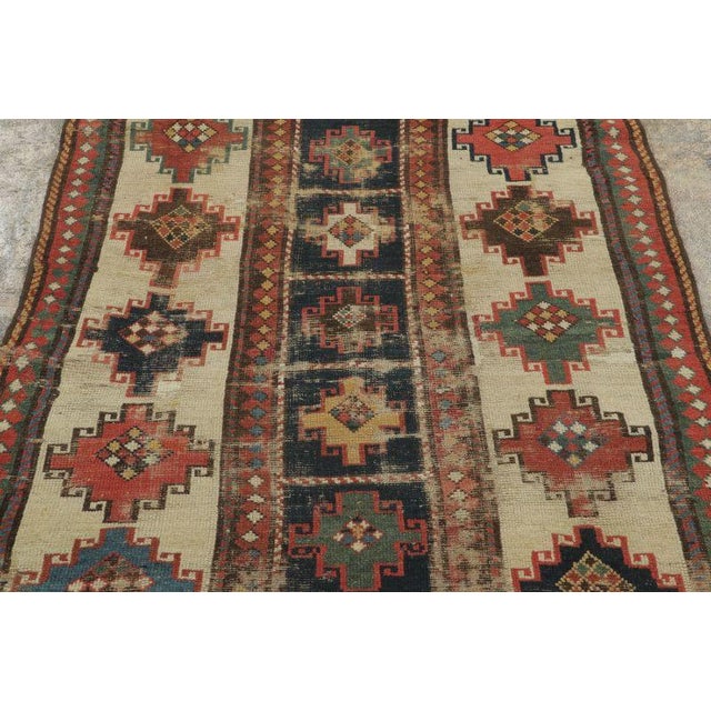 This 4x7 vintage Turkish Anatolian runner, handwoven in wool circa 1950–1959, features a striking geometric layout with...