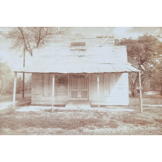 Vintage late 20th century cyanotype photograph on paper by Eric C. Weller (20th century) Texas. Old Texas storefront...