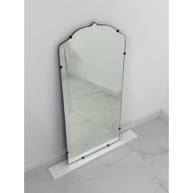 Italian Art Deco beveled wall mirror with brass accessories, 1940s Intact and in good condition. Minor signs of wear....