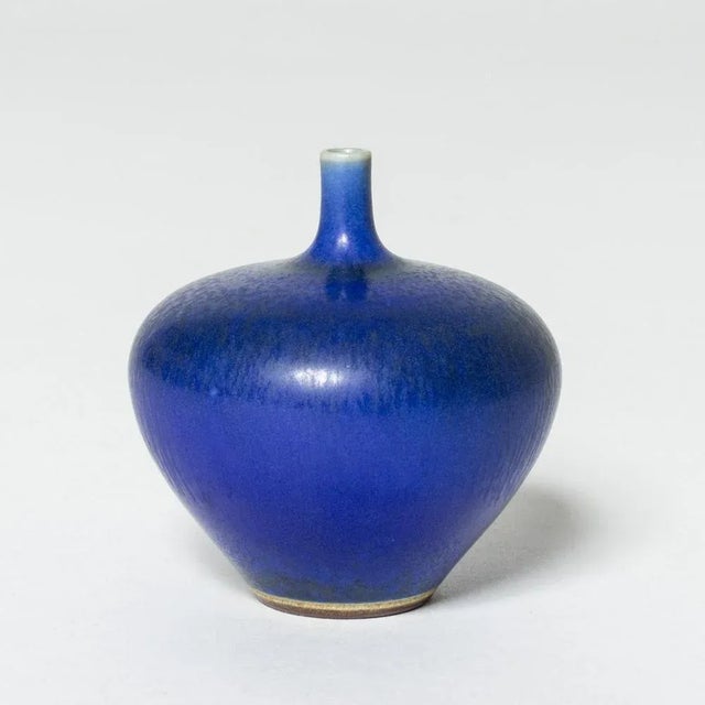 Miniature stoneware vase by Berndt Friberg in a plump apple form. Vibrant blue hare’s fur glaze. This piece has an...